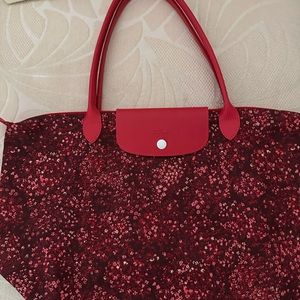 Longchamp 
Longchamp Red Tote Le Pilage Floral Medium size.